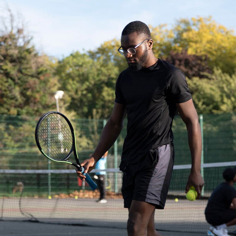 Man playing tennis.